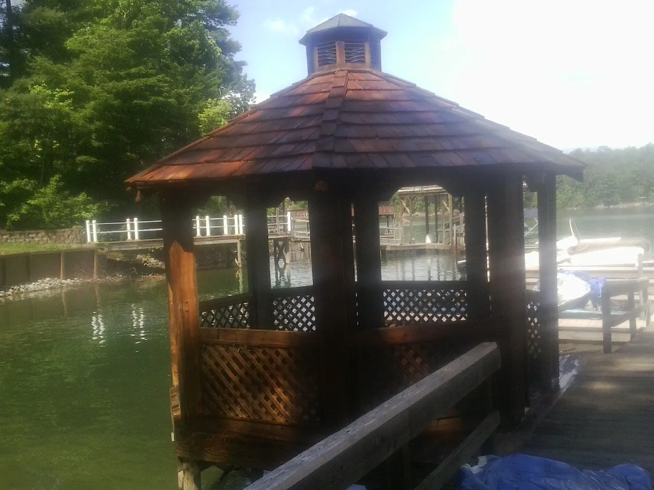 Cedar shake gazebo roof rebuilt on a lake dock in Pierceton